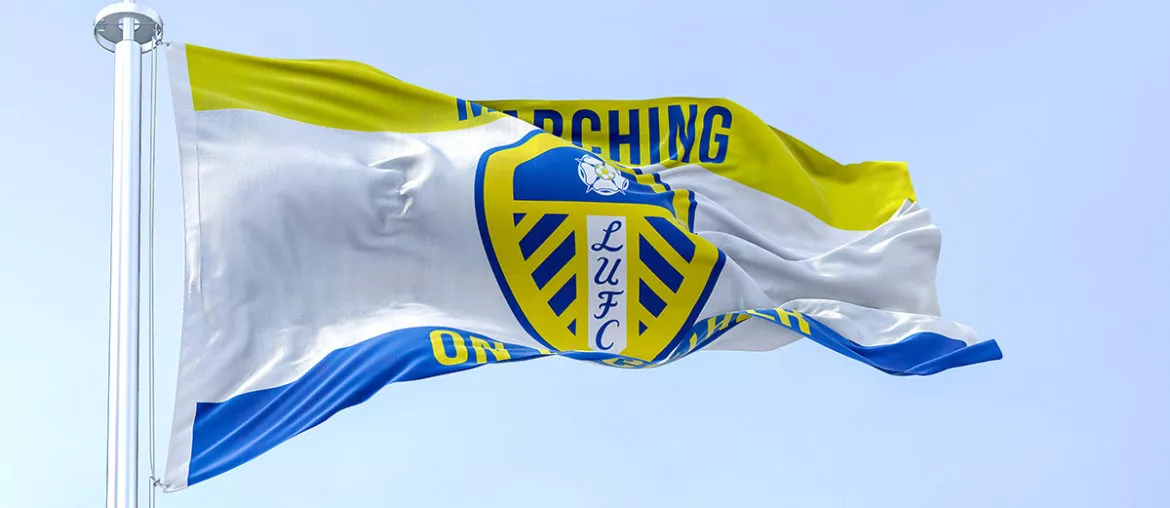 The Leeds United flag waving in the wind on a clear day