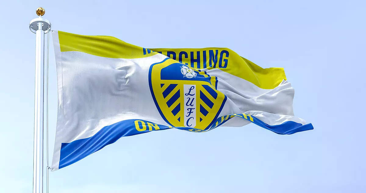 The Leeds United flag waving in the wind on a clear day